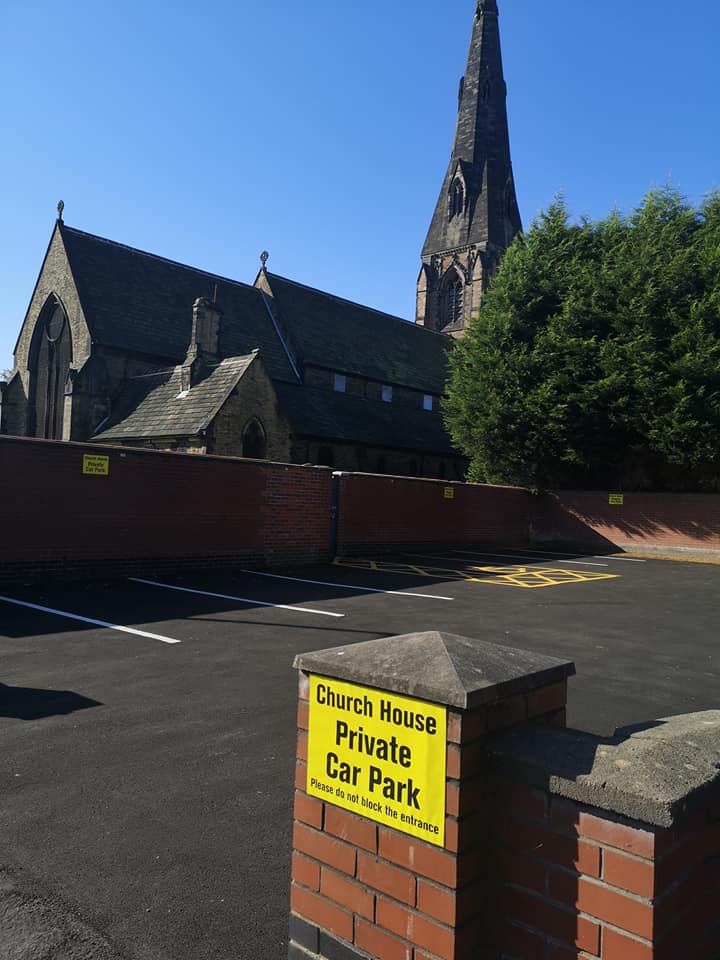 image of car park with spaces for 9 cars including a disabled bay