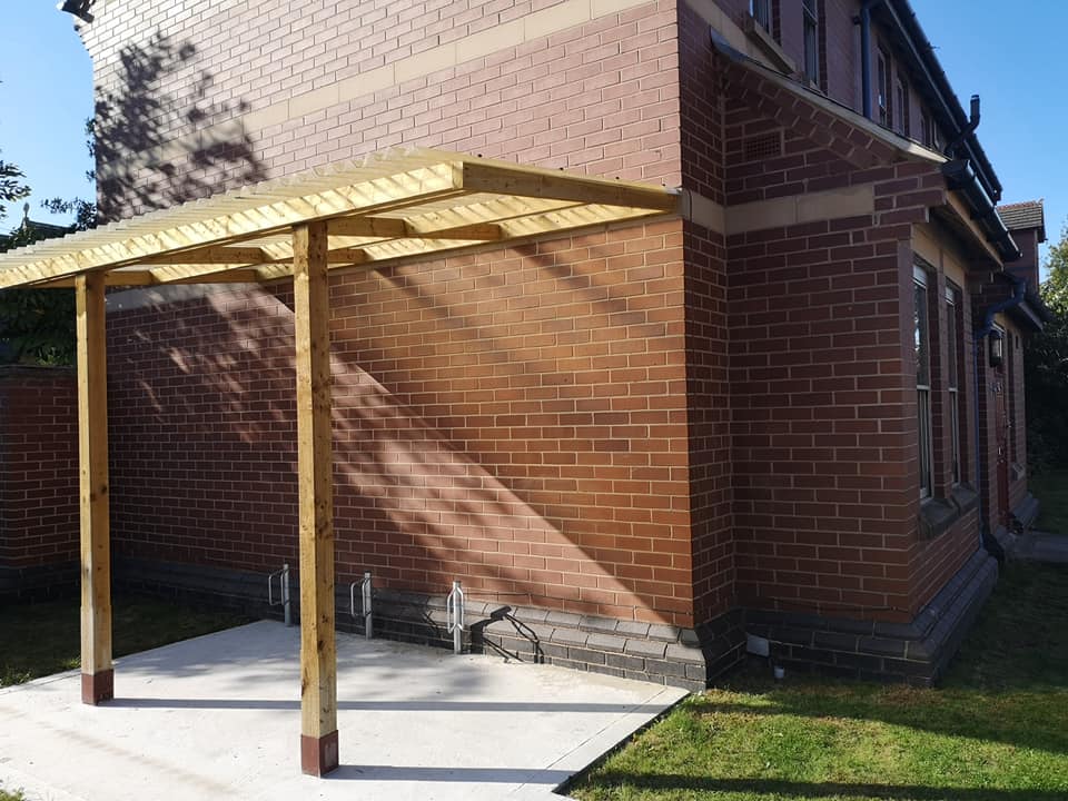 image of bike shed with space for three bicycles