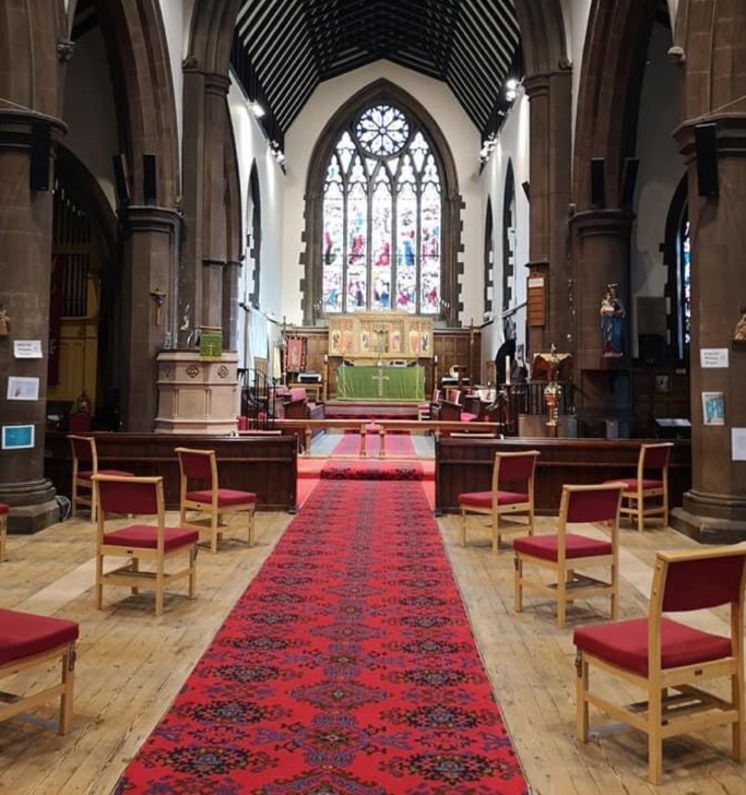 image of inside church with chairs spaced apart for social distancing