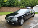 A limo full of balloons..with a hamper on top!